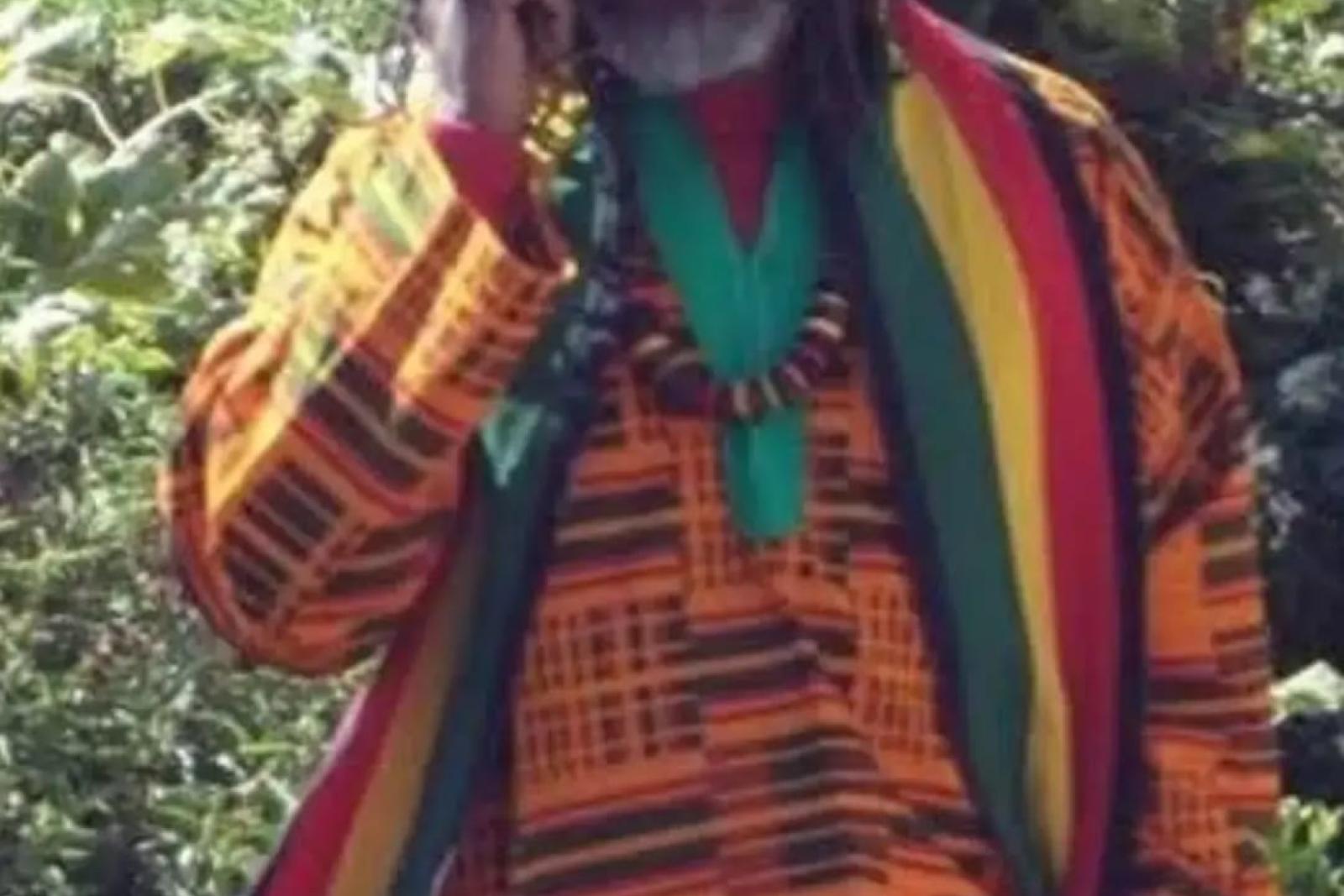 Fyah Mawi outdoors wearing a colourful patterned outfit.
